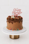 The Best Chocolate Cake in Pretoria - chocolate drip cake with Happy Birthday topper and rainbow sprinkles