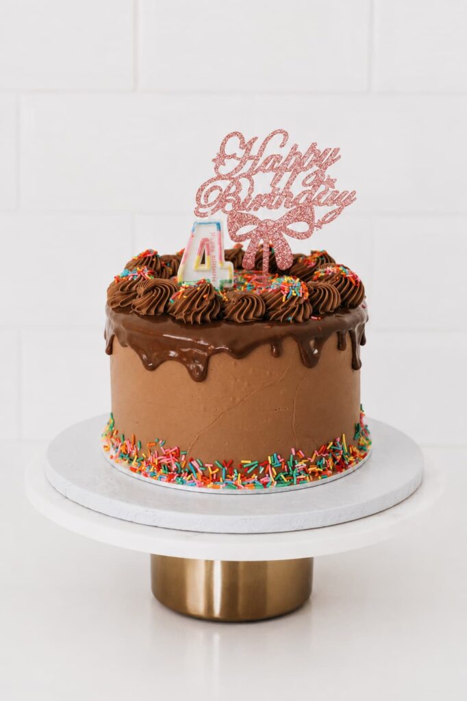 The Best Chocolate Cake in Pretoria - chocolate drip cake with Happy Birthday topper and rainbow sprinkles