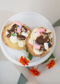 Sugar Cookies - top view of two loaded sugar cookies with marshmallows and Oreo crumble